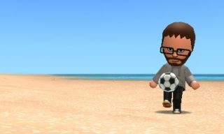 Tomodachi me playing football on the beach.