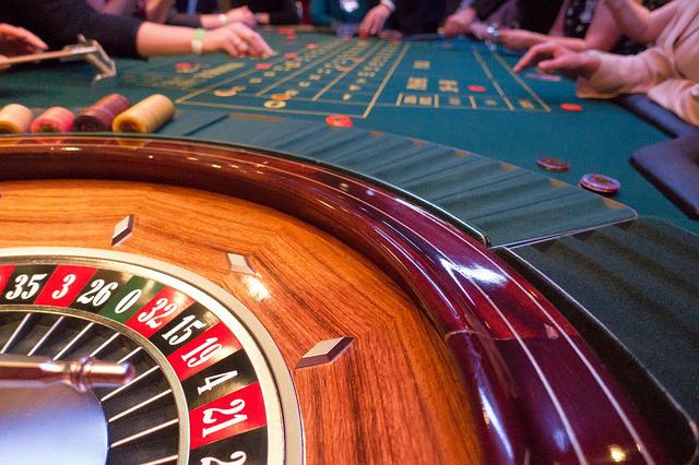 Players playing the roulette gambling game in a casino.
