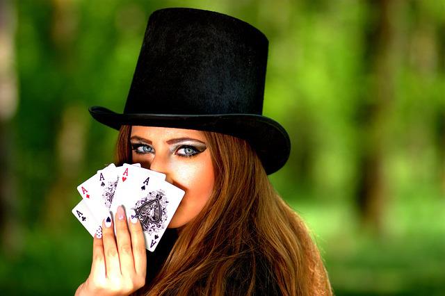 A woman showing off all her Ace cards.