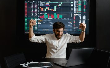 A man excited after making profits in trading.