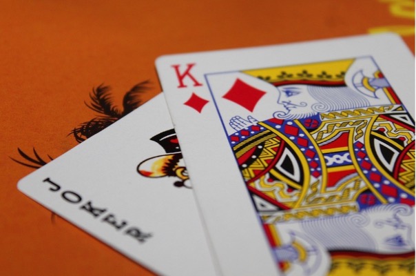 Poker cards with king and a Joker.