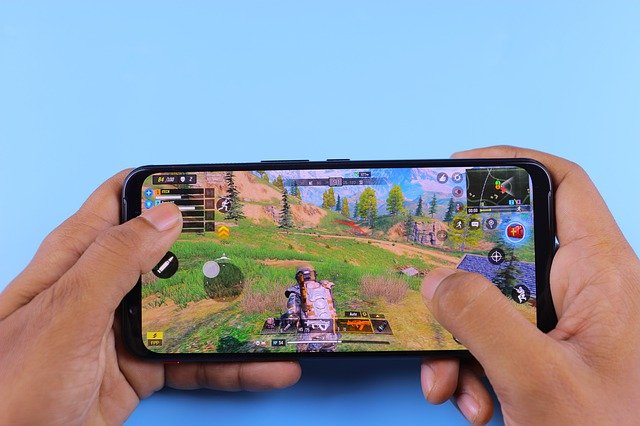 A boy playing games on phone.